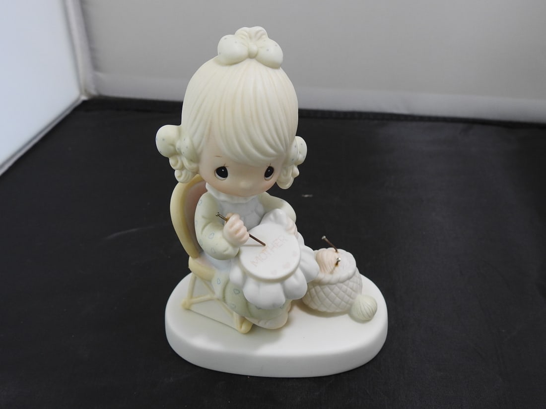Precious Moments Porcelain Figurine: Precious Moments Porcelain Figurine. "Mother Sew Dear" Serial # E-3106 By Enesco Copyrighted 1979 - Jonathan & David Approx. 5 x 4 x 2.5 in.