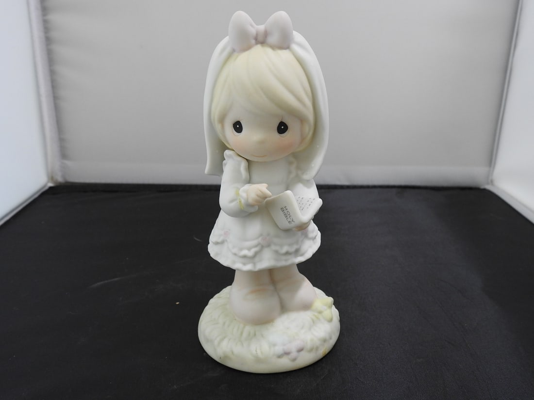 Precious Moments Porcelain Figurine: Precious Moments Porcelain Figurine. "This Day has been made in heaven" Serial #523496 By Enesco Copyrighted 1989 - Samuel J. Butcher Approx. 6 x 3 x 3 in.
