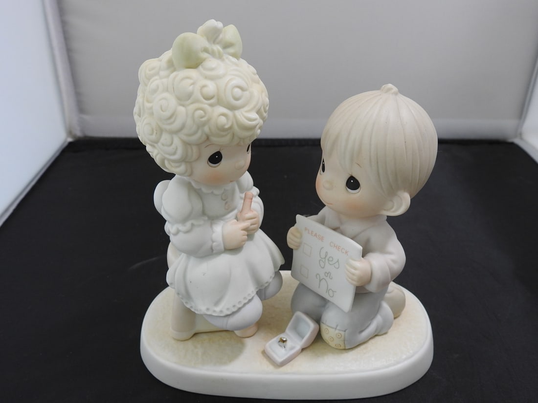 Precious Moments Porcelain Figurine: Precious Moments Porcelain Figurine. "Wishing you a Perfect Choice" Serial #520845 By Enesco Copyrighted 1988 - Samuel J. Butcher Approx. 6 x 6 x 3 in.