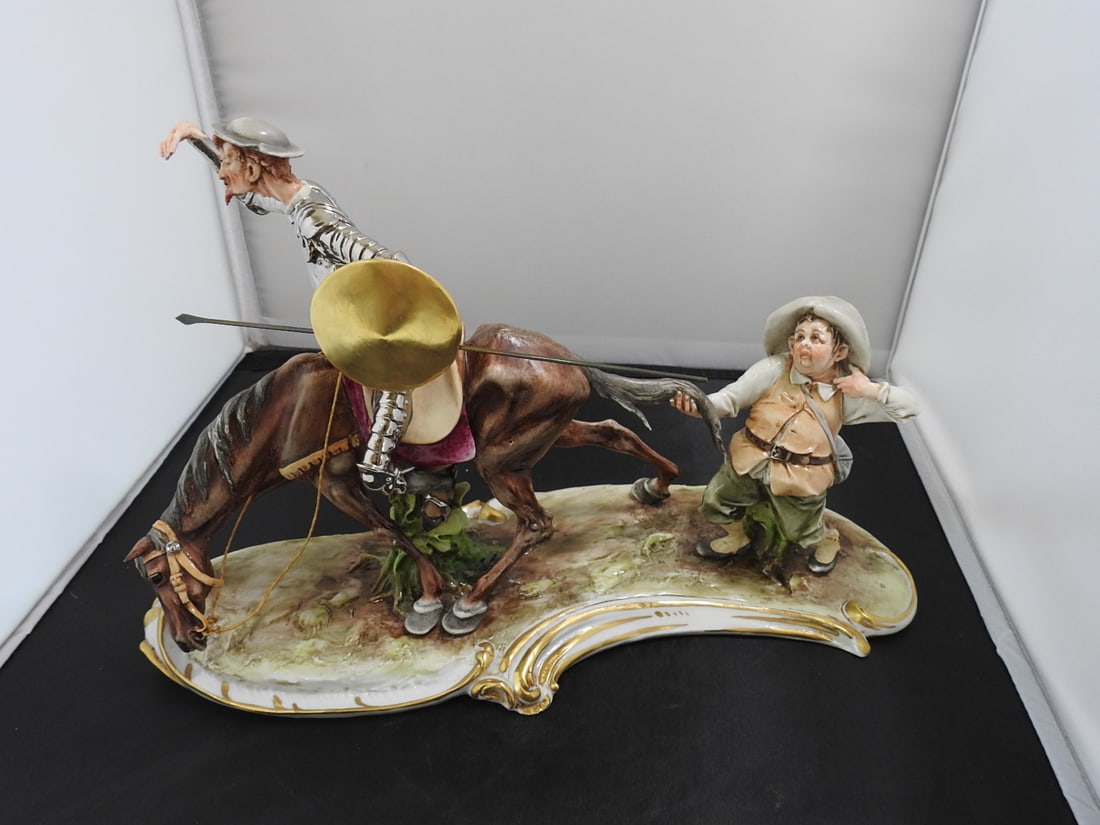 Capodimonte Porcelain Don Quixote Figurine: Capodimonte Porcelain Don Quixote Figurine. Gold giltt, detachable spear, hand-painted, made in italy Approx. 9 x 13 x 6.5 in.