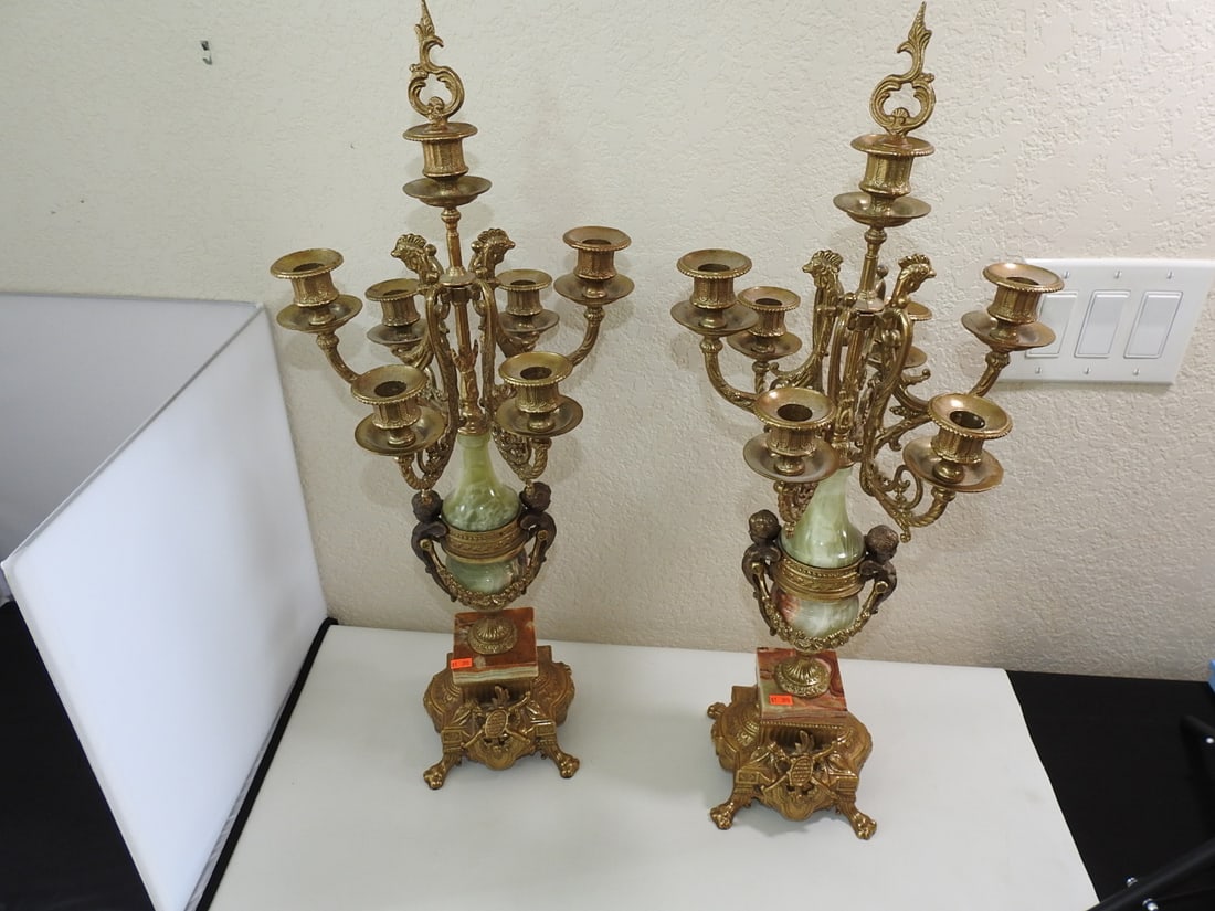 Pair of Monumental Italian Gilt Metal & Banded Onyx Seven-Light Candelabra: Impressive pair of Italian seven-light candelabra featuring ornate gilt-finished cast metal construction with richly detailed neoclassical decoration. Each is centered by a hand-turned banded green, c