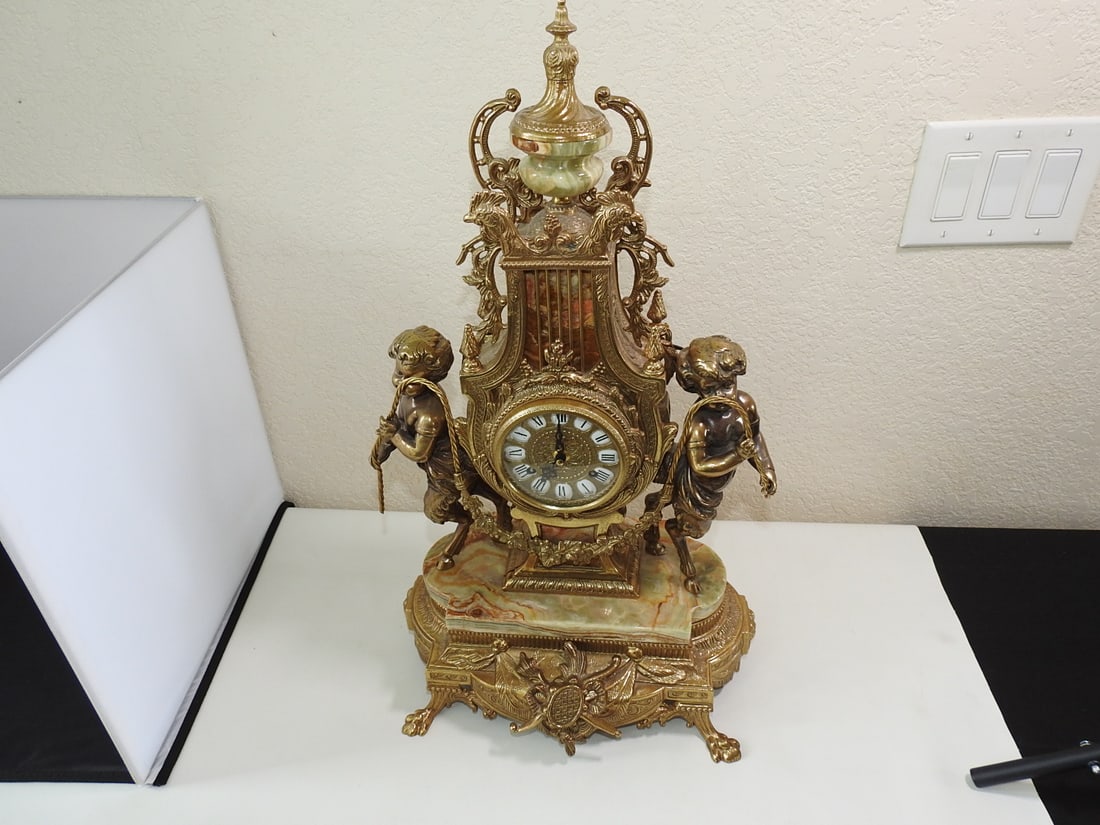 Monumental Italian Gilt Metal & Onyx Three-Piece Garniture Clock Set: Monumental Italian three-piece garniture comprising a lyre-form mantel clock and matching pair of seven-light candelabra. Features gilt-finished cast metal with detailed Rococo and neoclassical orname