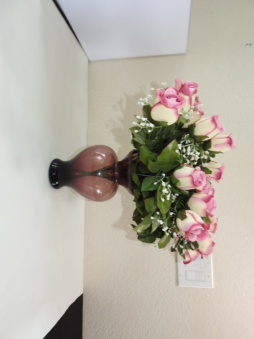 Silk Stemmed Roses in Vase: Silk Stemmed Roses in Vase. Purple Amethyst Glass Approx. 21 x 14 x 14 in.