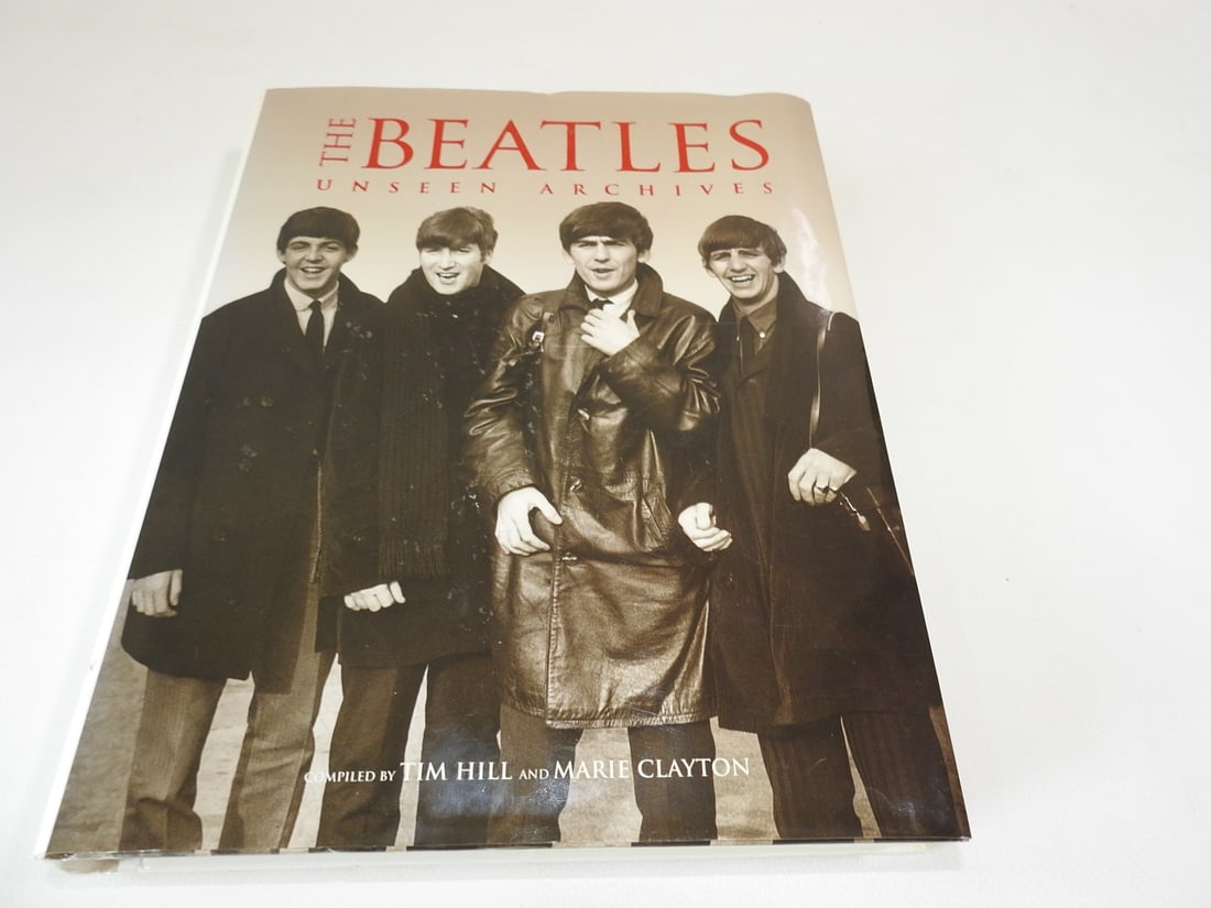 The Beatles: Unseen Archive by Tim Hill & Marie Clayton: Decorative or collectible hardcover volume. Approx. 11 x 9 x 1.5 in.