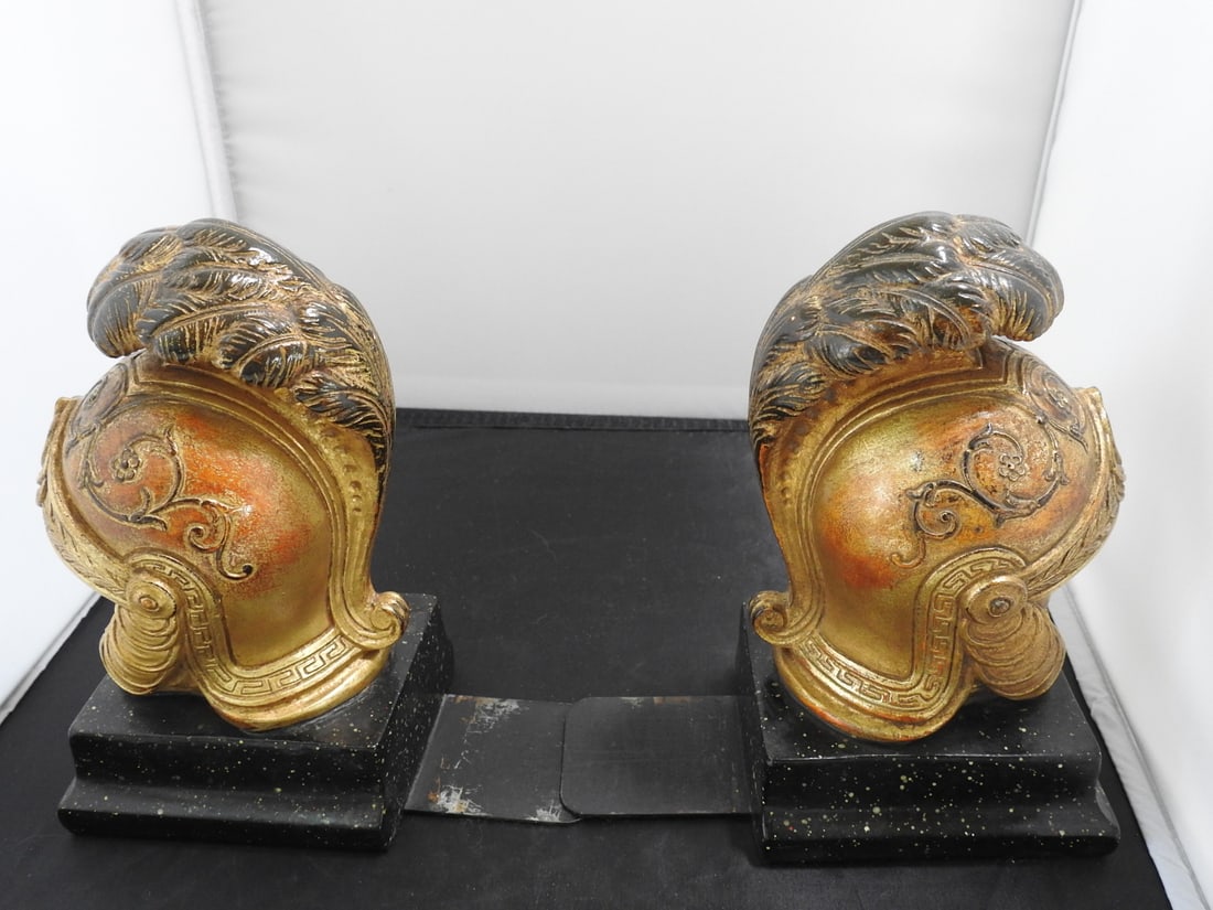 House of Borghese Neoclassical Roman Helmet Bookends: Pair of vintage House of Borghese neoclassical Roman helmet bookends with gilt finish, faux marble bases, and bottom extenders. Approx. 8 x 8 x 7.5 in.