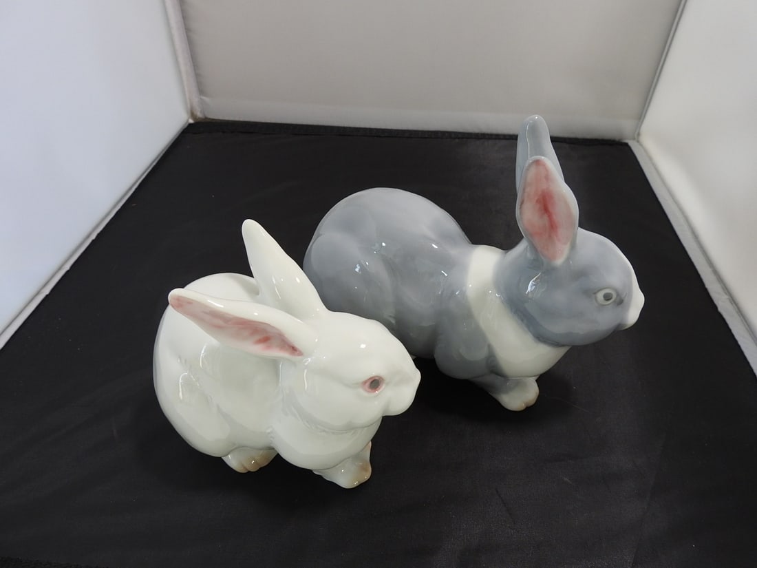 Pair of Vintage Japanese Porcelain Rabbit Figures: Pair of vintage Japanese porcelain rabbit figures with glossy white and gray finishes and original Japan label. Approx. 5.5 x 6.75 x 7 in.