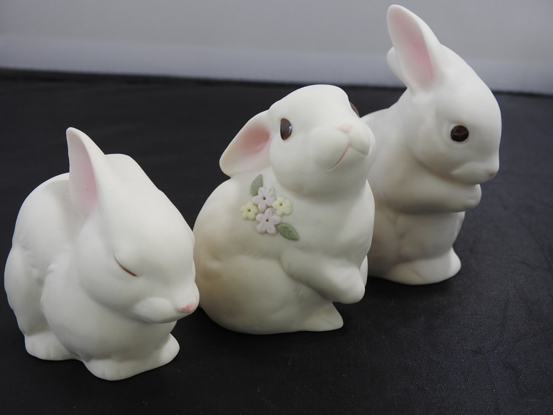 Set of Three Japanese Porcelain Bisque Rabbit Figures: Set of three Japanese porcelain bisque rabbit figures in white finish with floral accent decoration and original Japan label. Approx. 3.75 x 5.5 x 3.5 in.