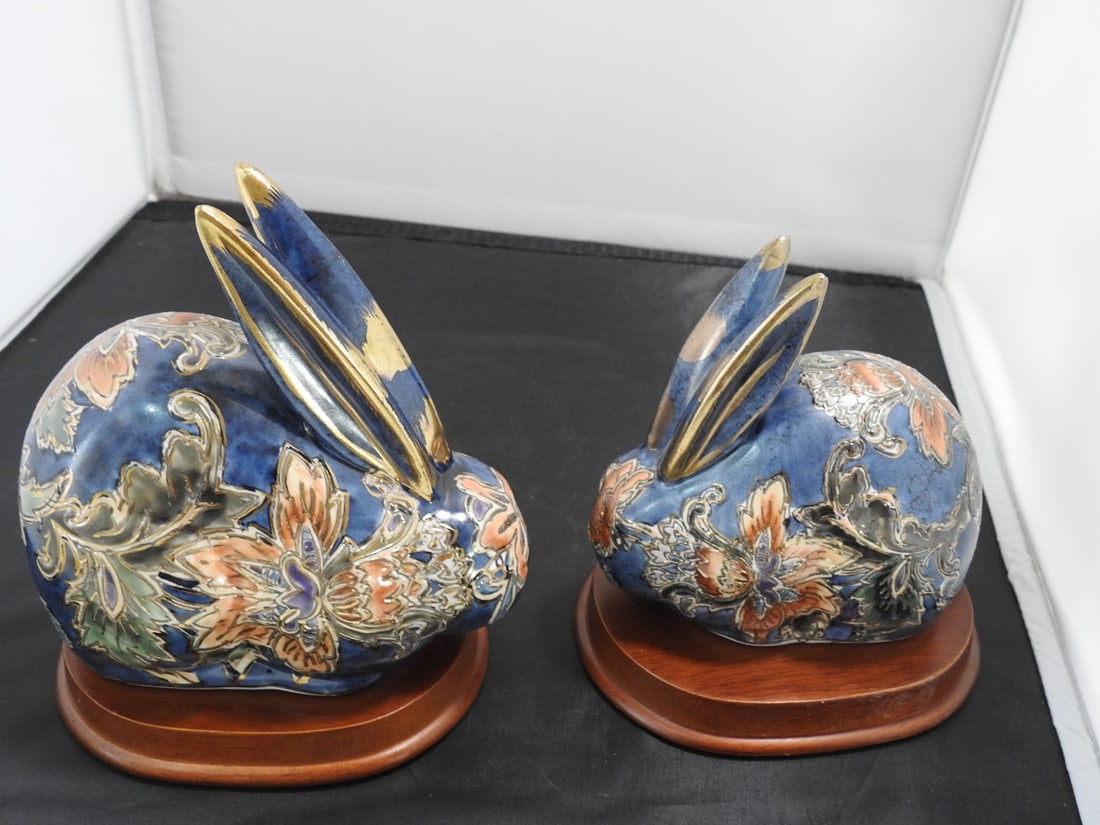 Pair of Satsuma Style Rabbit Figures on Wood Bases: Pair of vintage Satsuma style rabbit figures with colorful floral decoration, gilt accents, and wooden bases. Made in China. Approx. 6.5 x 8 x 5.5 in.