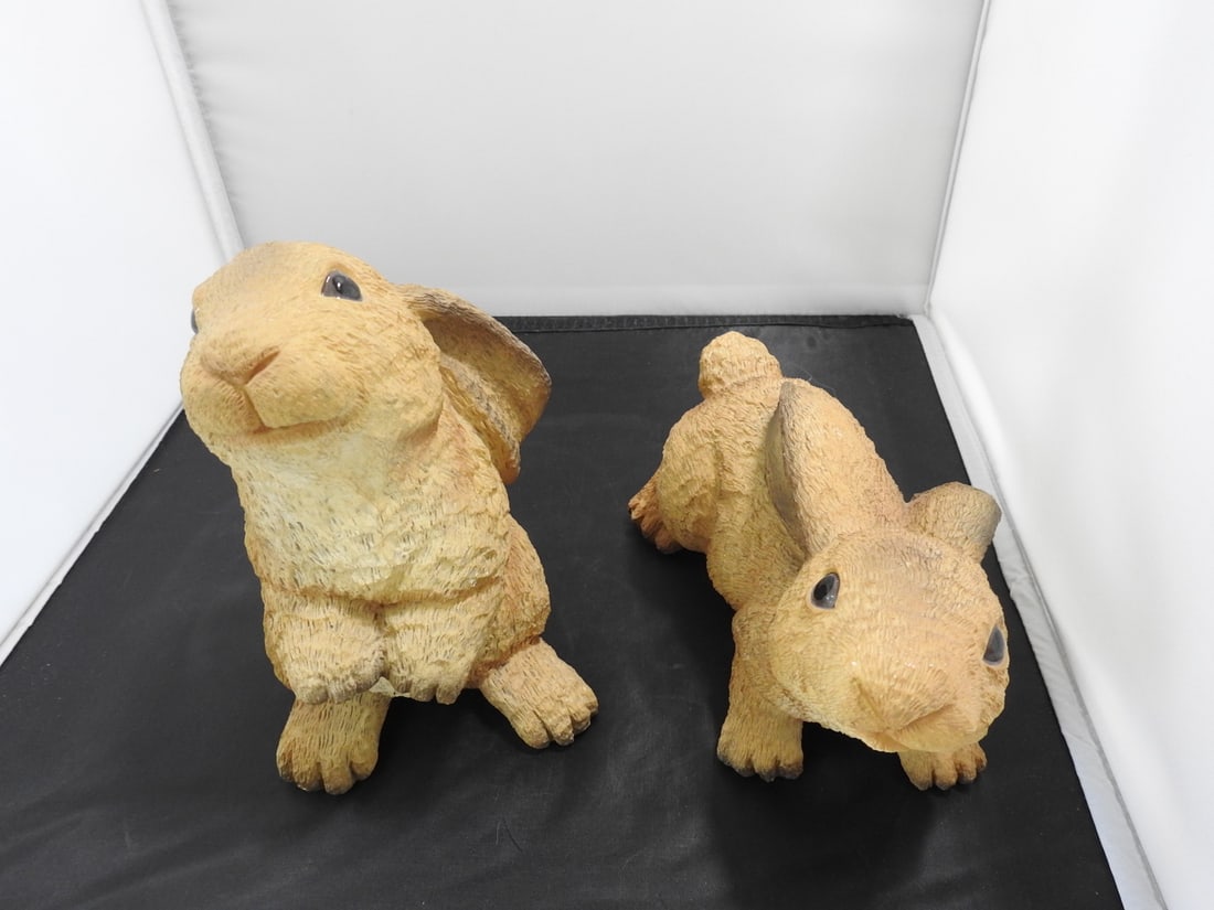 Pair of Brown Hand-Painted Bunny Figurines: Pair of lightweight resin bunny figurines with hand-painted brown textured finish. Approx. 7.5 x 8.5 x 8.75 in.