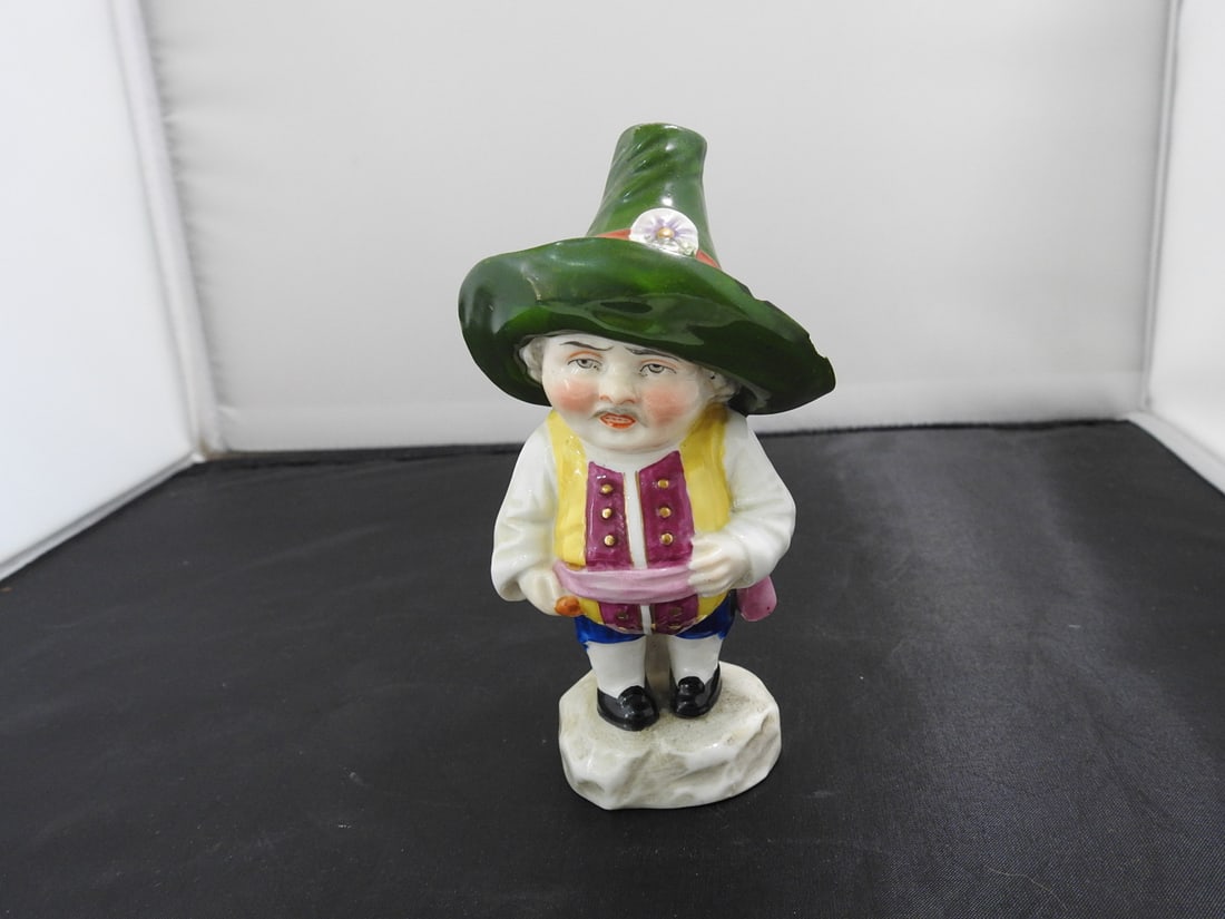 Antique German Mansion House Dwarf Porcelain Figure: Antique German porcelain Mansion House Dwarf figure with hand-painted decoration. Two chips on back of hat have been painted in; see photos. Approx. 5.25 x 3 x 2.5 in.