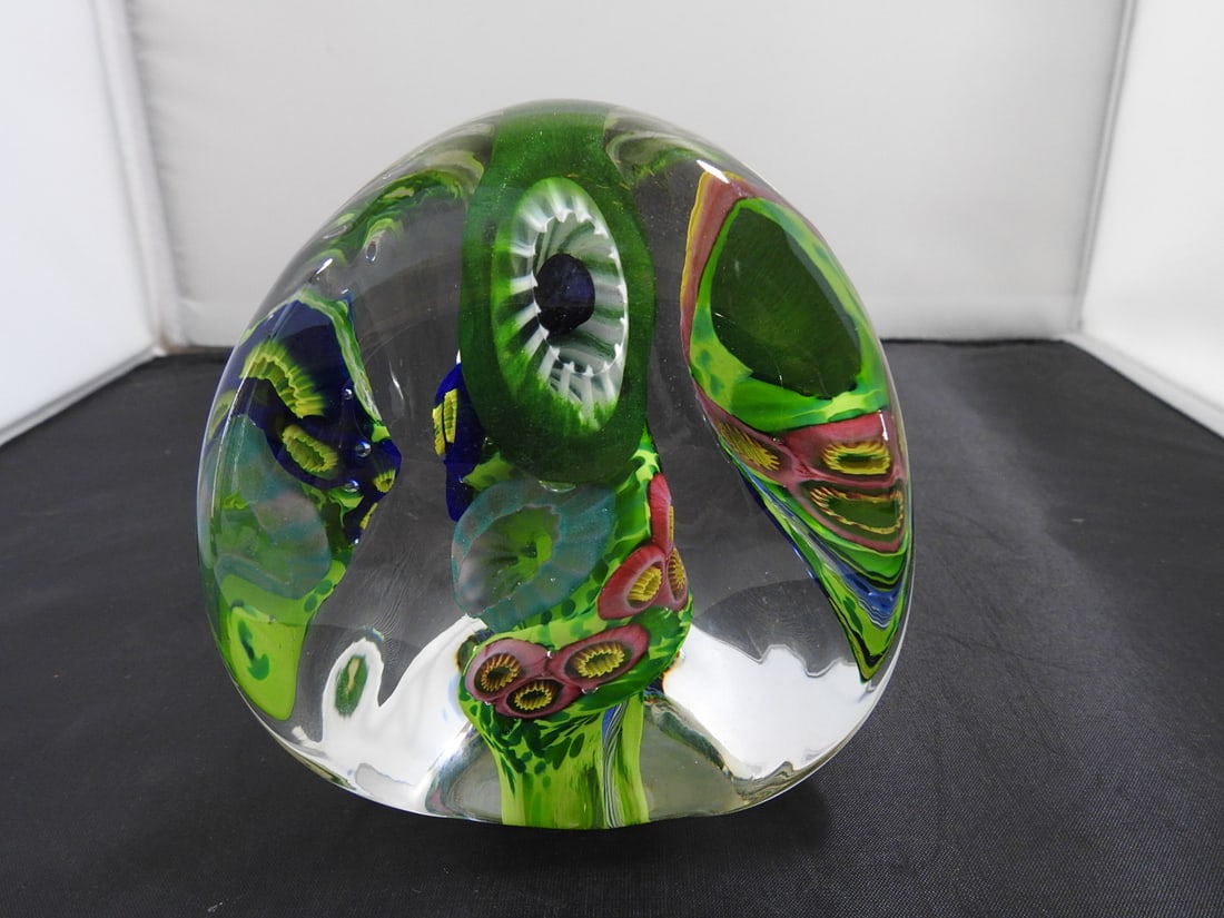 Signed Art Glass Paperweight by Henry 1998: Art glass paperweight with green, black, and clear abstract design. Signed Henry 1998 and numbered 19. Approx. 4.75 x 4.5 x 4.5 in.