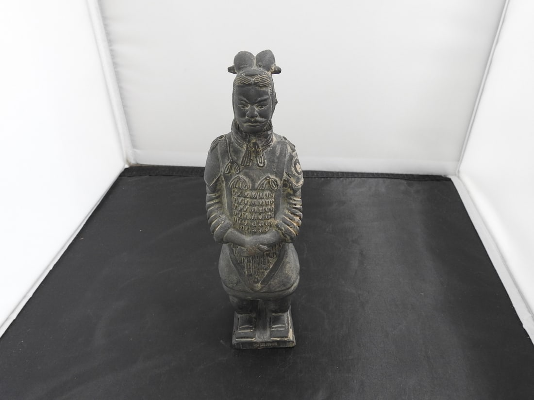 Miniature Terra Cotta Warrior Figure: Miniature terra cotta warrior figure on rectangular base. Head has been repaired; see photos. Approx. 8.5 x 2.75 x 2.5 in.