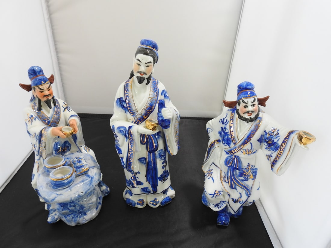 Vintage Fu Lu Shou Blue and White Porcelain Statues: Vintage reproduction Fu Lu Shou porcelain statue set with cobalt blue painted decoration and gold gilt accents. Approx. 10 x 9 x 6.25 in.