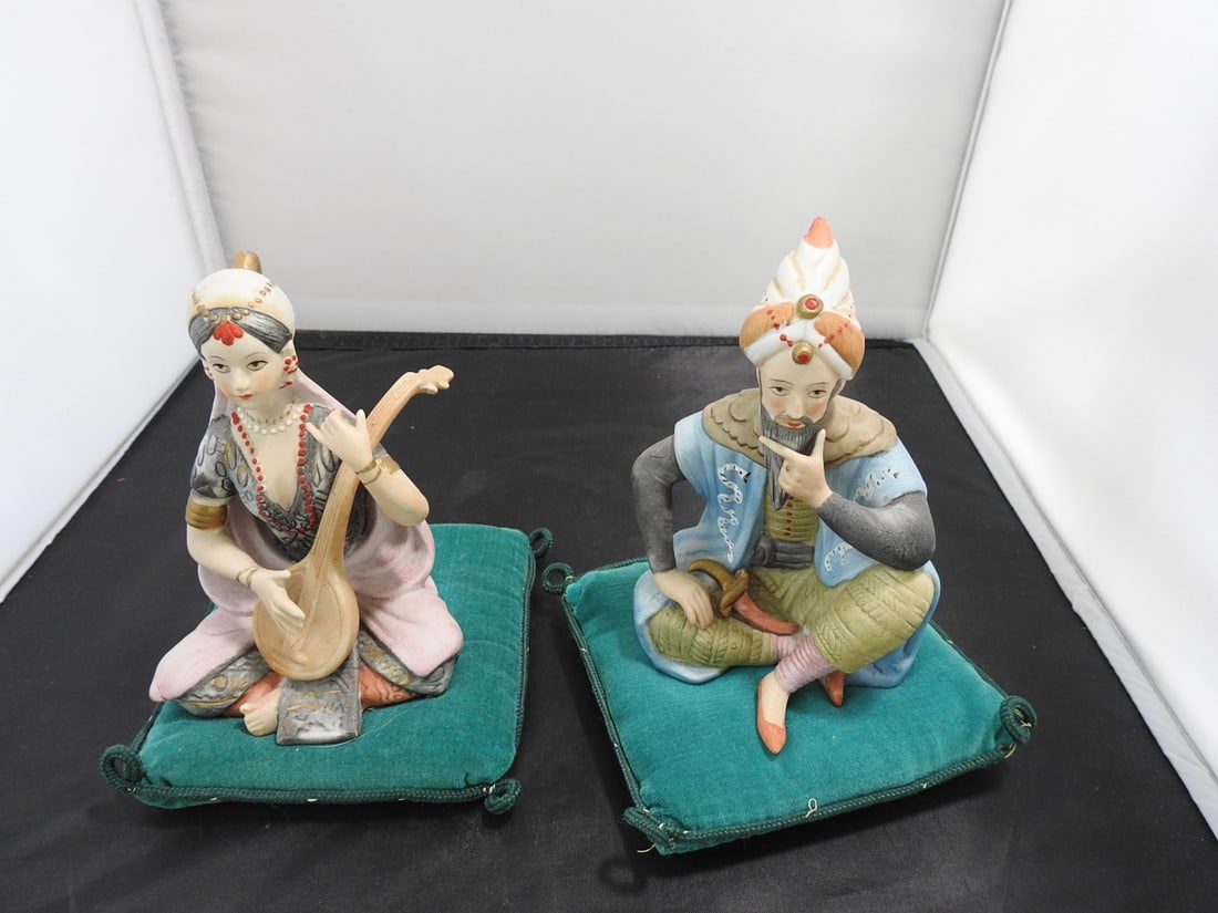 Lenwile Ardalt Persian Couple Bisque Porcelain Figurines: Pair of vintage Lenwile Ardalt Persian couple bisque porcelain figurines, made in Japan, each mounted on a green base. Approx. 6.5 x 9.5 x 5 in.
