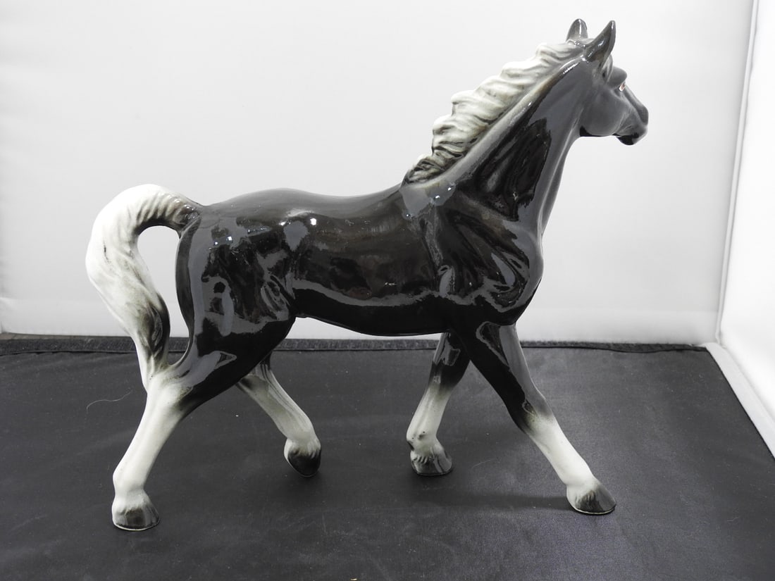 The Rise Company Japan Ceramic Black Horse Figurine: Ceramic black horse figurine by The Rise Company, Japan. Hand-decorated finish with white mane and tail details. Approx. 8 x 9.5 x 3.25 in.
