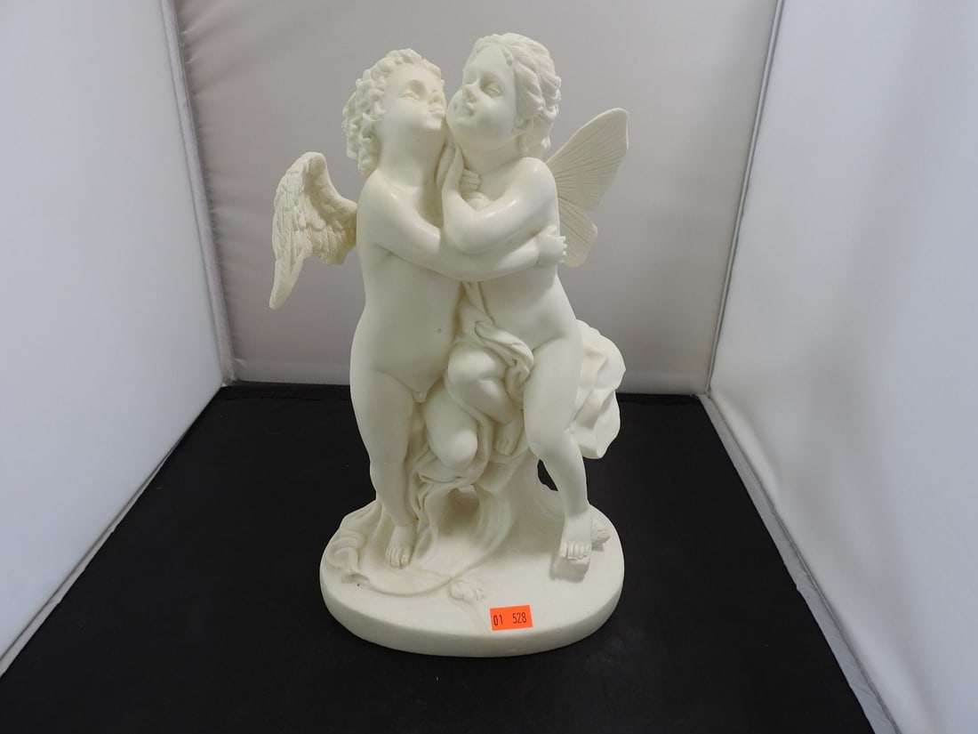 The First Kiss Faux Marble Resin Sculpture: Decorative hard resin faux marble sculpture after The First Kiss, depicting embracing figures with cherub/angel detail. Approx. 11.5 x 7 x 5.25 in.