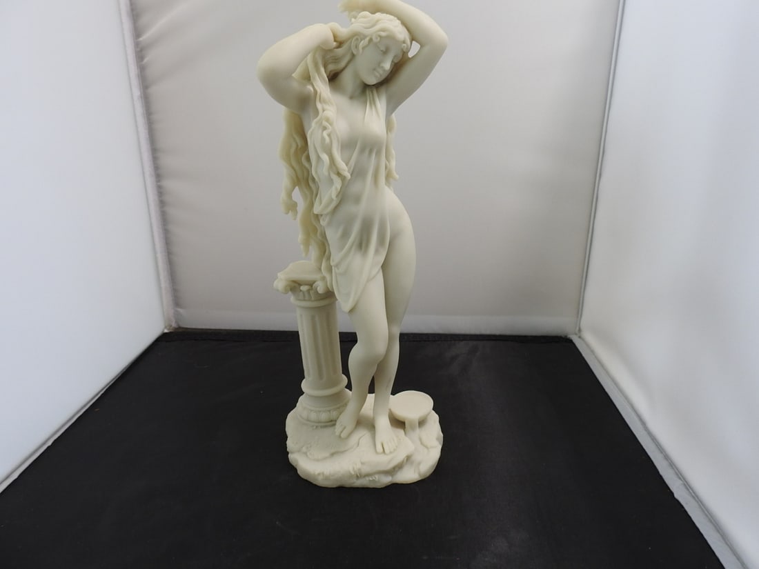 Aphrodite Faux Marble Resin Statue: Classical Aphrodite style faux marble resin statue on molded base. Approx. 11.25 x 5 x 4 in.