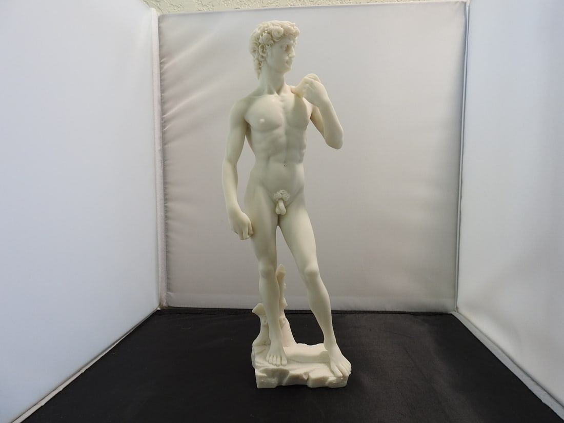 David Classical Resin Statue: Top Land Trading Myths and Legends line classical statue depicting David with white marble-look finish. Approx. 13 x 5 x 3.5 in.