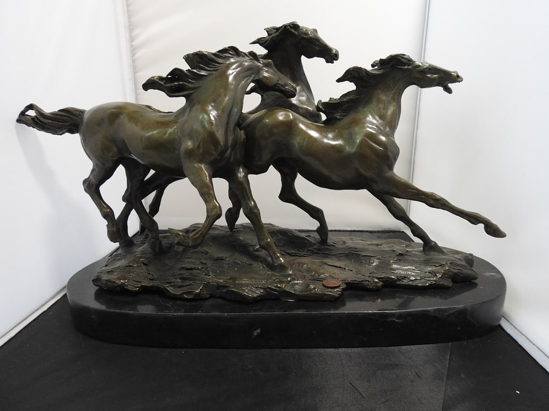 European Bronze Finery Wild Horses Bronze Sculpture: Bronze sculpture of running wild horses on black marble base, by European Bronze Finery and signed P. Lecourtier per notes. Approx. 11 x 18.25 x 8 in.