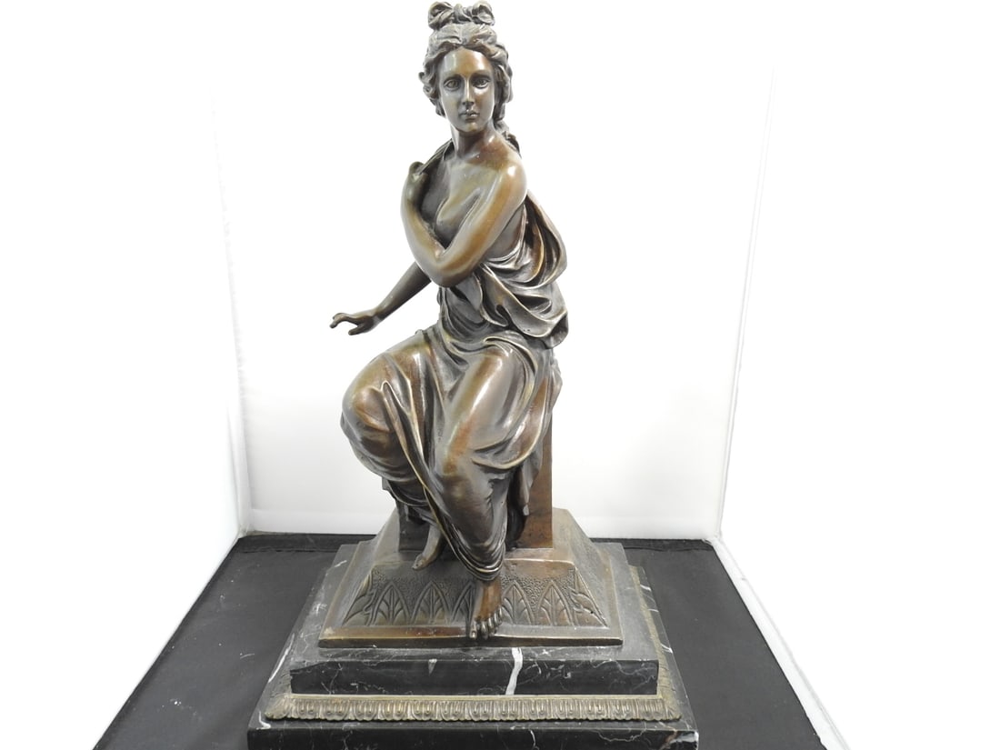 Bronze Seated Lady Statue on Black Marble Base: Bronze seated lady figure on black marble base, made in Hong Kong per notes. Approx. 16 x 11 x 7.75 in.