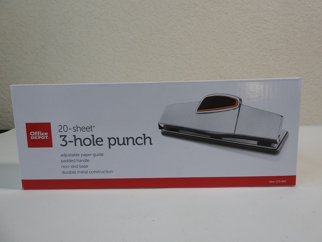 Office Depot 20-Sheet Three-Hole Punch: Office Depot 20-sheet three-hole punch, new in box. Approx. 5 x 11 x 3 in.