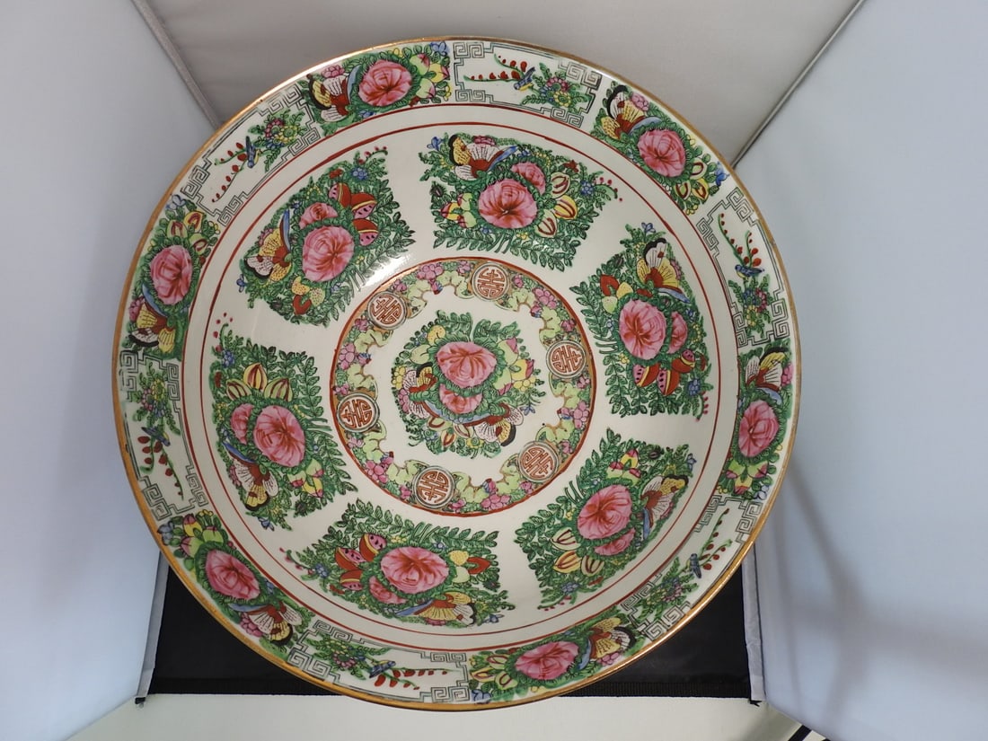 Large Vintage Famille Rose Style Chinese Export Porcelain Bowl: Large vintage Chinese export style porcelain bowl with famille rose floral decoration, pink peonies, butterflies, green foliage, patterned borders, and gold accents. Approx. 8 x 16 x 16 in.