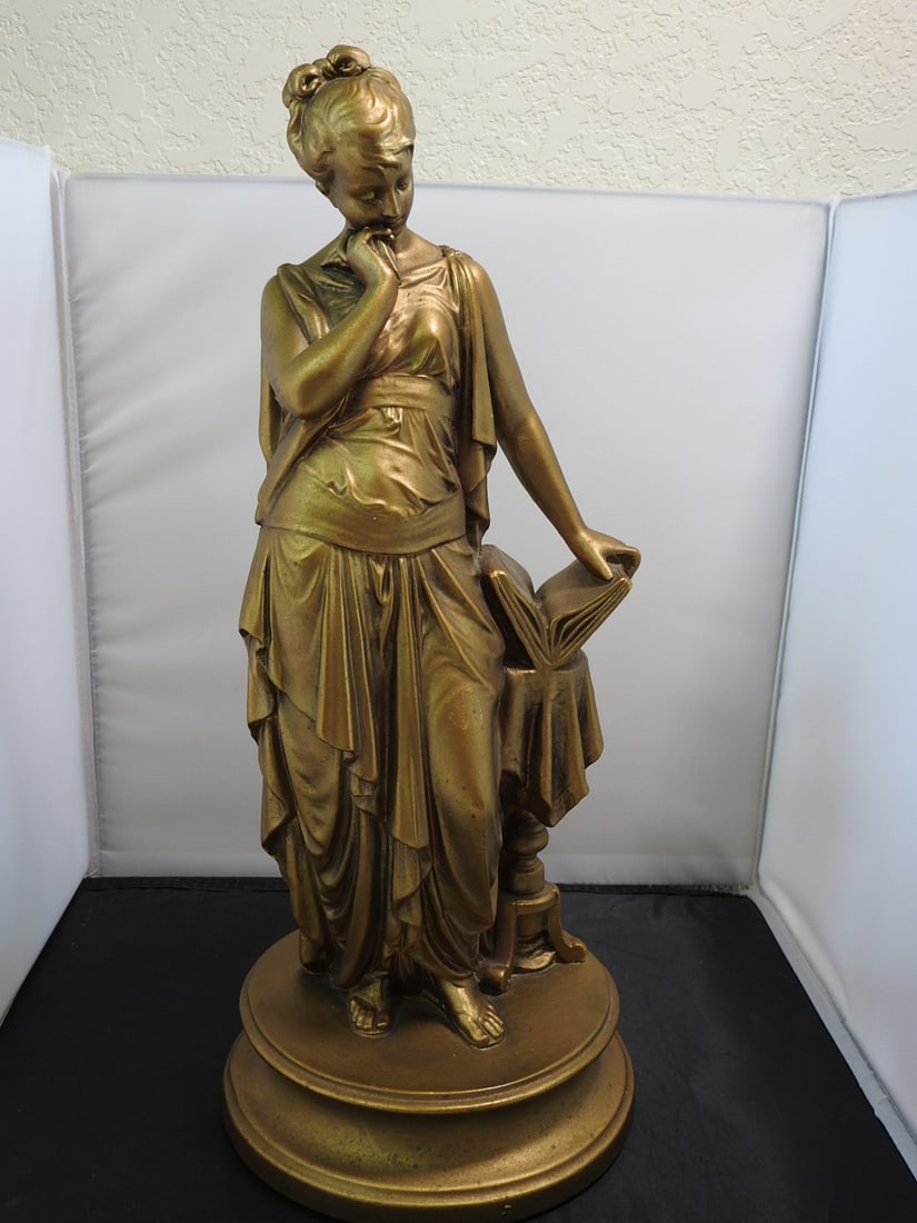 Esco Products Clio Muse of History Faux Bronze Statue: Mid-century style Clio, Muse of History faux bronze statue by Esco Products, mounted on a round base. Approx. 18 x 8 x 8 in.