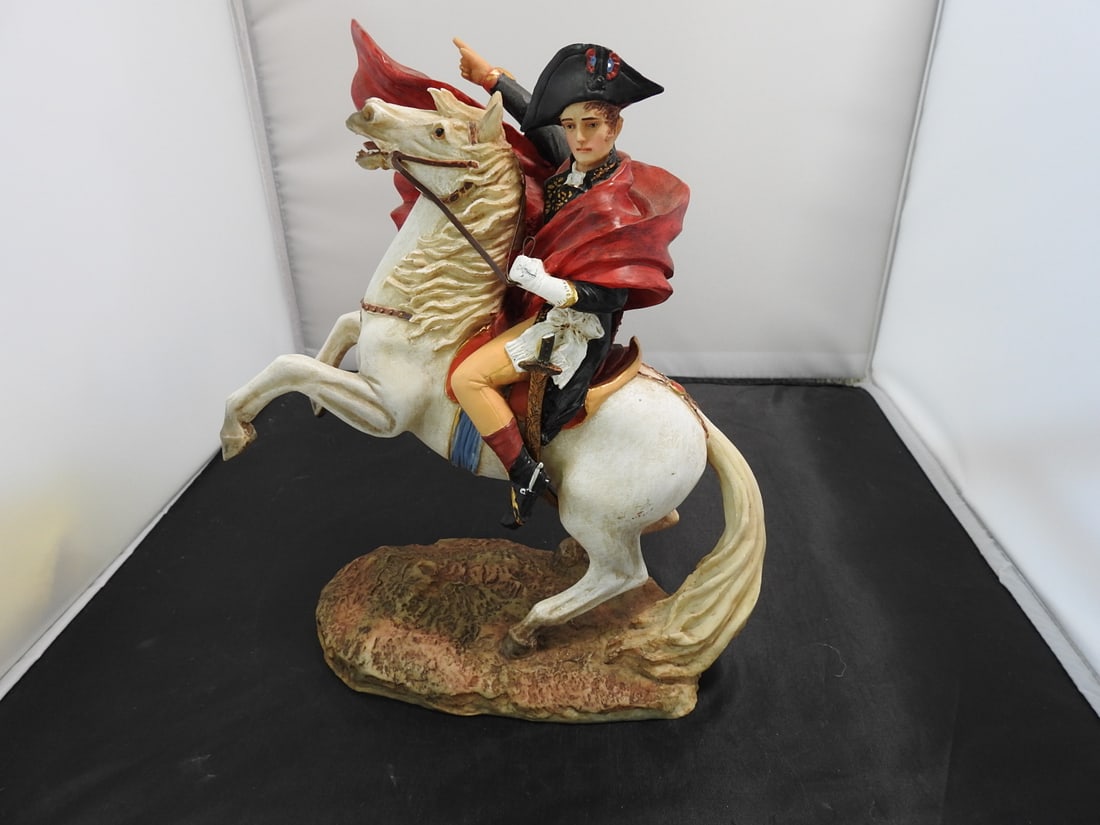 Napoleon Crossing the Alps Resin Equestrian Statue: Napoleon Crossing the Alps resin equestrian statue signed Taranus. Sword is broken as shown. Approx. 10 x 8.5 x 4.75 in.