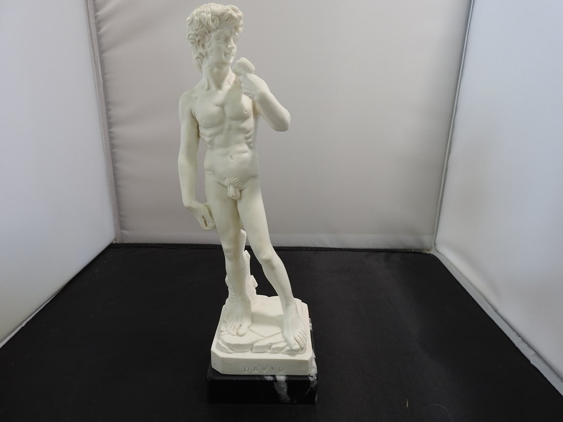 Classical David Resin Statue on Black Marble Base: Classical David resin statue mounted on a black marble base and signed A. Giannetti. Approx. 10 x 3.5 x 3.5 in.