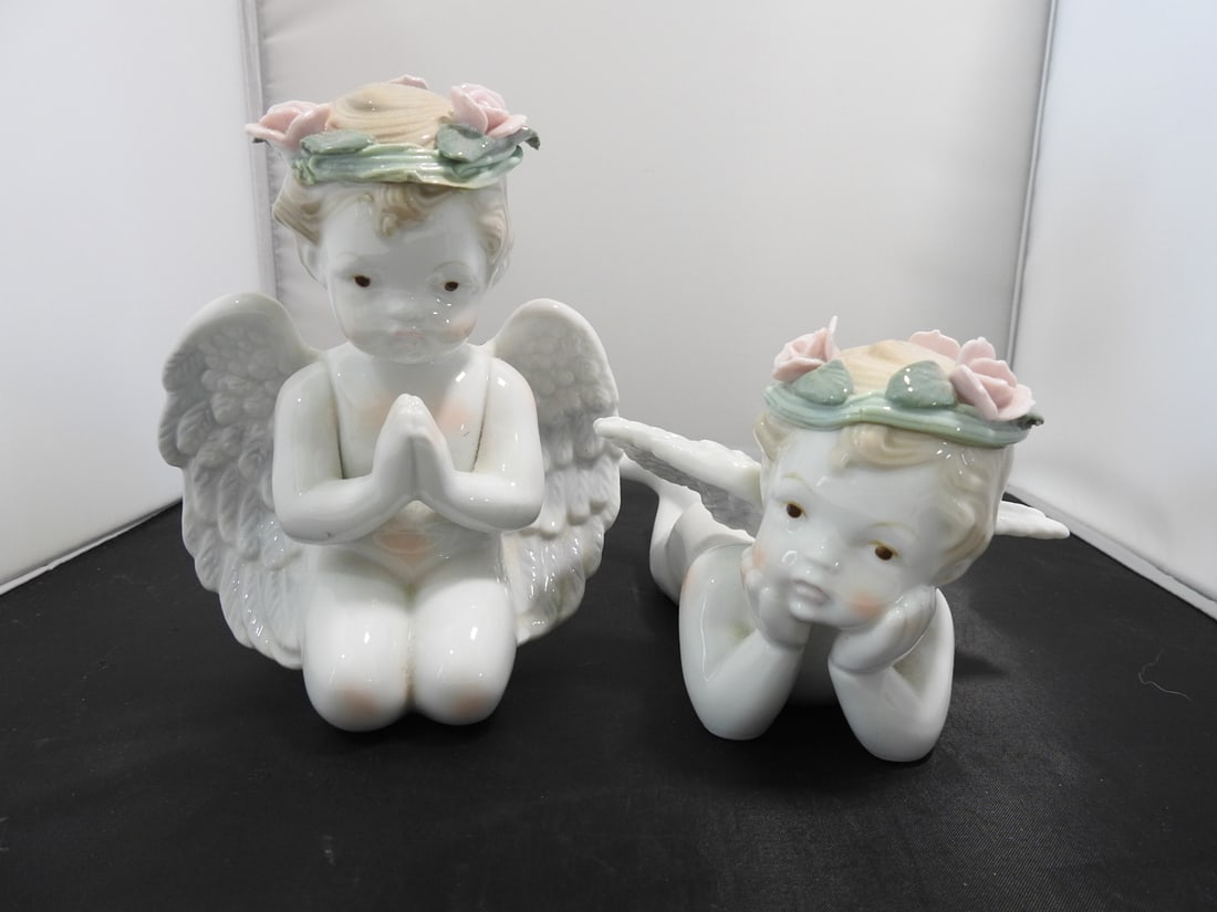 Set of Cottagecore Porcelain Cherub Figurines: Set of cottagecore style porcelain cherub figurines with floral accents and sweet figural forms. Measured as a set. Approx. 7 x 9 x 9 in.
