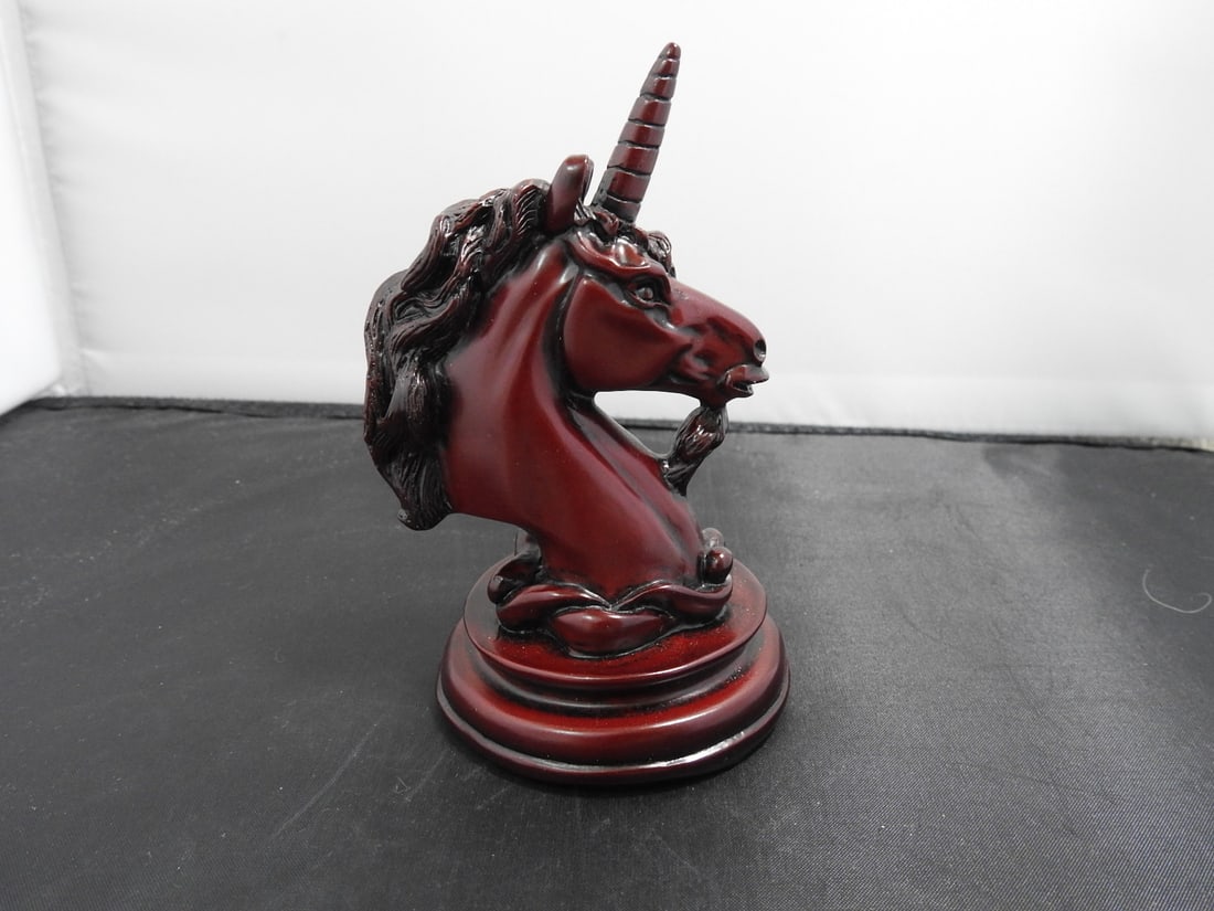 Small Faux Cinnabar Unicorn Figurine: Small hard resin unicorn figurine with faux cinnabar-style red finish and black accent base. Approx. 5.25 x 5.25 x 3 in.