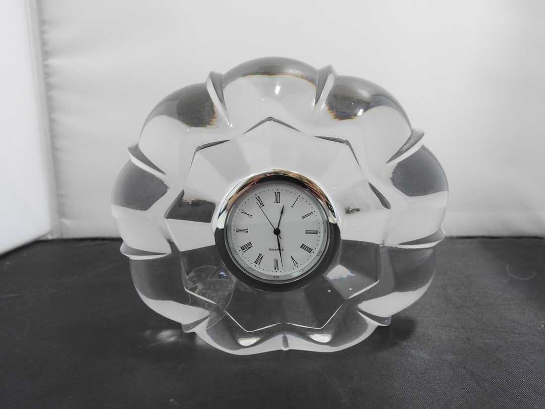 Royal Limited 24% Lead Crystal Desk Clock: Royal Limited crystal desk clock in 24% lead crystal, made in Czech Republic, with flower-form / scalloped crystal body and inset clock face. Approx. 5 x 6 x 2 in.