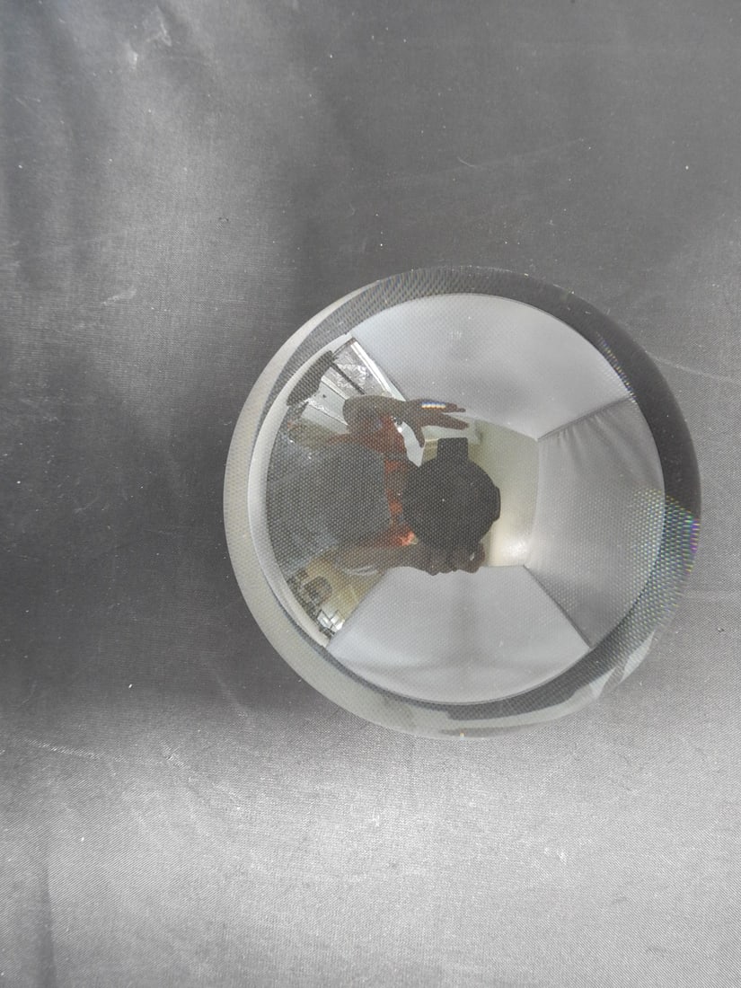 MagnaBrite Magnifying Dome Paperweight: MagnaBrite magnifying dome paperweight in clear hard plastic / acrylic, designed for reading or desktop magnification. Approx. 3.25 x 4 x 4 in.