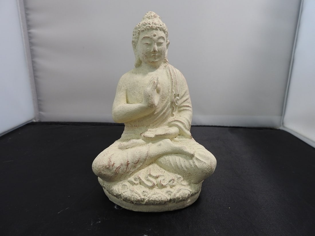 Faux Stone Buddha Resin Figure: Hard resin Buddha figure with faux stone finish and seated pose. Approx. 6.5 x 4.5 x 3.75 in.