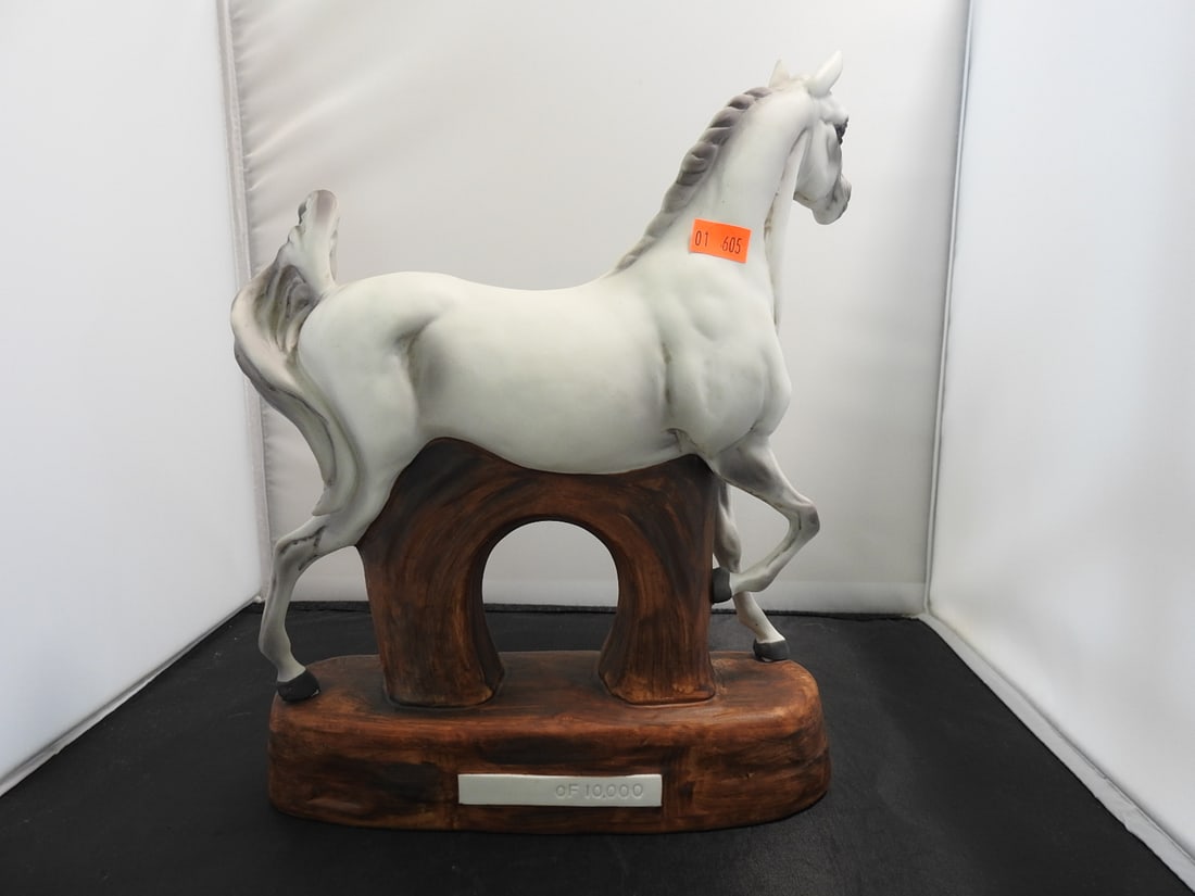 The Arabian Hand-Painted Porcelain Horse Figure: The Arabian hand-painted porcelain/bisque horse figure by Western Distilling, mounted on a wood-look base. Approx. 11 x 10 x 3.25 in.