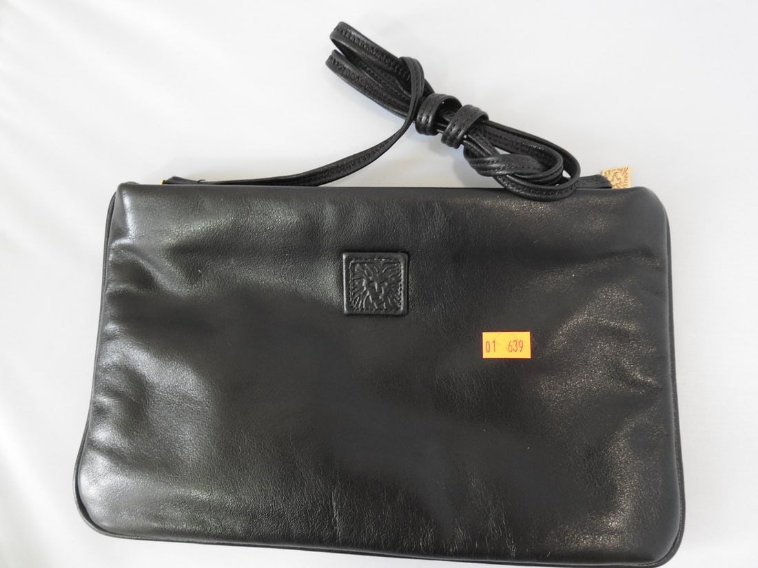 Anne Klein Black Genuine Leather Evening Bag: Anne Klein black genuine leather evening bag / clutch in new condition per notes, with zip closure and wrist strap. Approx. 6.5 x 10.25 x 1 in.