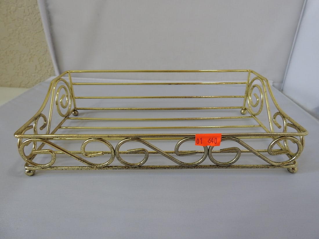 Gold-Tone Wire Kleenex Box Holder: Gold-tone wire Kleenex / tissue box holder with open scrollwork design. Approx. 2.75 x 9.5 x 5.25 in.