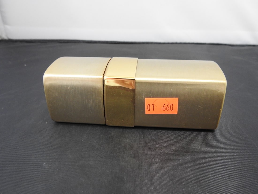 Vintage Chanel No. 5 Gold Eau de Parfum Bottle: Vintage Chanel No. 5 Eau de Parfum in original gold-tone metal body, serial 10019, approximately half full. Approx. 4.5 x 1.5 x 1.5 in.