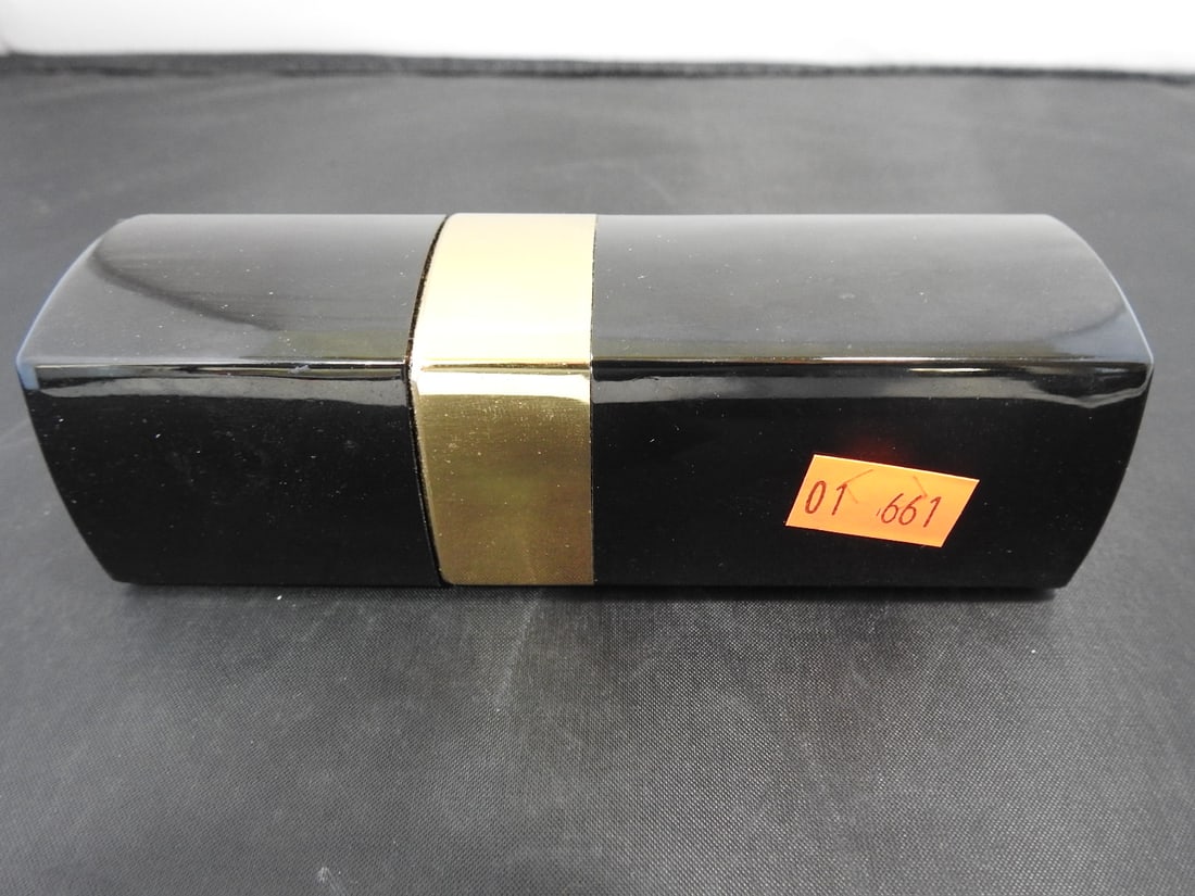 Vintage Chanel No. 5 Black Eau de Toilette Bottle: Vintage Chanel No. 5 Eau de Toilette in original black hard plastic body, serial 10019. Approx. 5.25 x 1.75 x 1.75 in.
