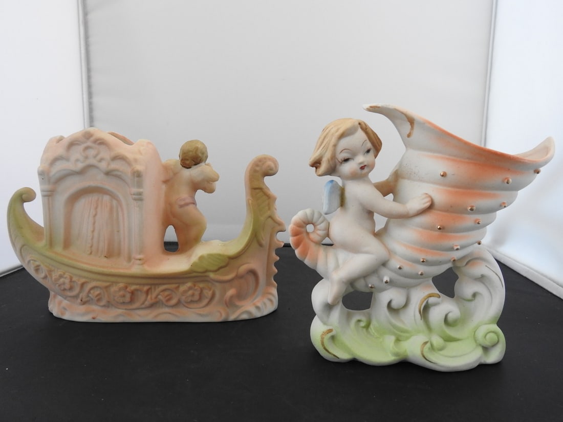 Pair of Vintage Hand-Painted Porcelain Figural Vases: Pair of vintage hand-painted bisque porcelain figural vases / decorative pieces, made in Japan, with pastel and gilt accents. Measured as a pair. Approx. 6.5 x 7 x 5 in.