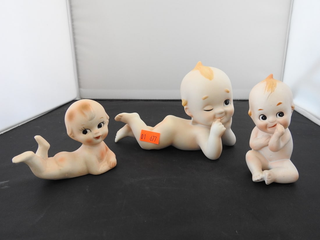 Lefton China Kewpie Piano Baby Figures Set of 3: Set of three Lefton China Kewpie piano baby figures, hand-painted, each in a different reclining / seated pose. Measured as a set. Approx. 4.5 x 6 x 5.5 in.