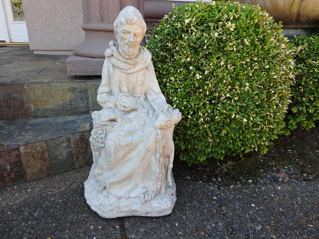 St. Francis of Assisi Classical Garden Statue: Classical Baroque style garden statue of St. Francis of Assisi with aged stone-look finish. Approx. 28 x 14.5 x 13.5 in.