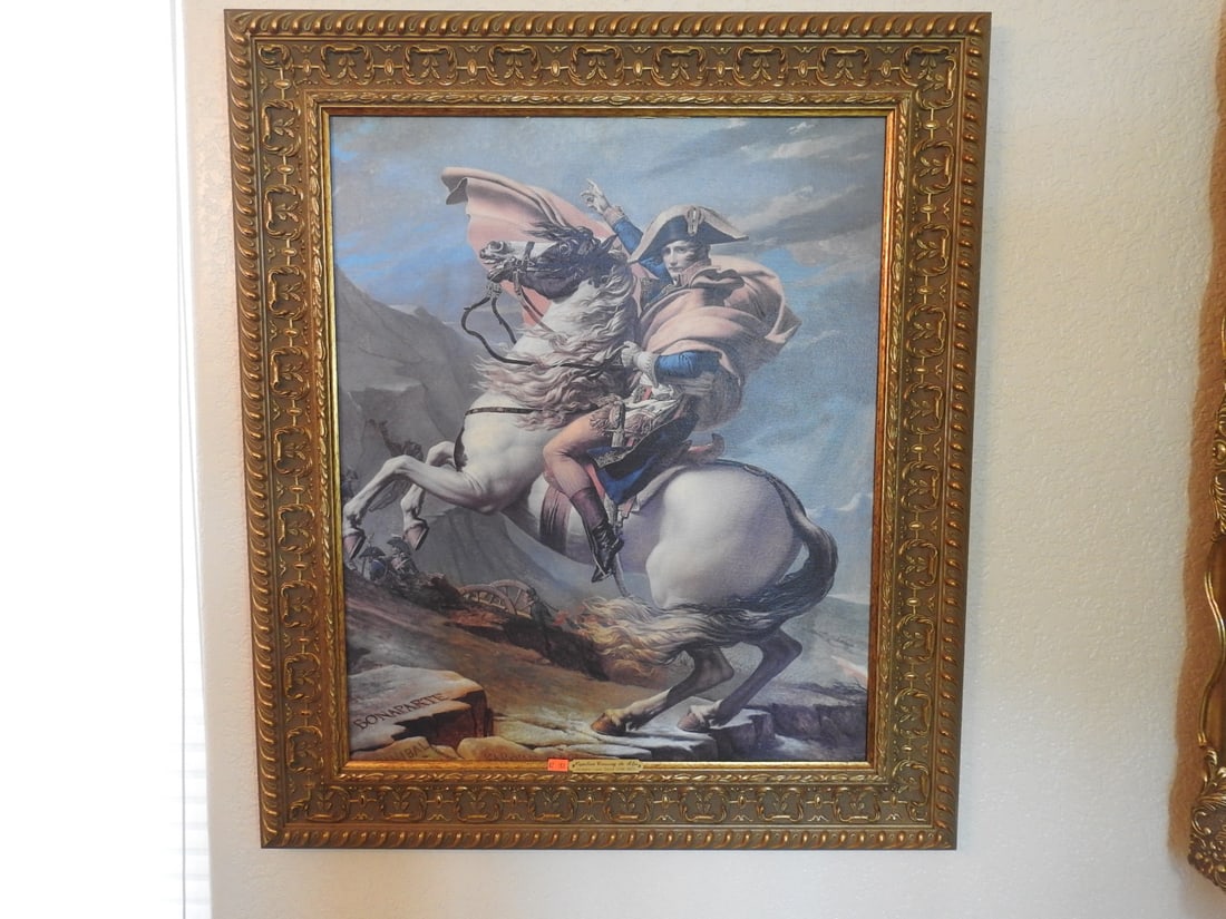 Napoleon Crossing the Alps Framed Reprint: Framed reprint of Napoleon Crossing the Alps in decorative gilt frame. Approx. 32.25 x 28 x 1.5 in.
