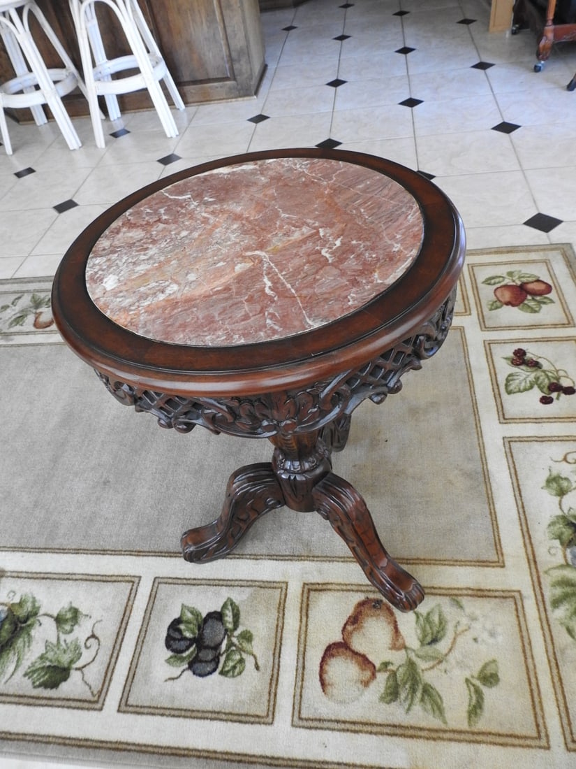 Rococo Style Accent Table with Marble Top: Rococo style carved accent table / plant stand with round Breccia Pernice marble top, carved mahogany base, and shaped legs. Approx. 29.5 x 21.5 x 21.5 in.