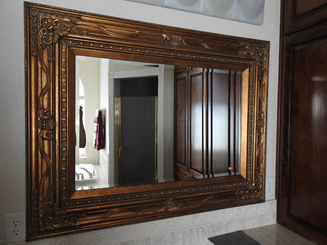 Baroque Rococo Style Large Wooden Wall Mirror: Large Baroque Rococo style wooden wall mirror with ornate carved-look frame and gilt-tone accents. Approx. 38.5 x 50 x 3 in.