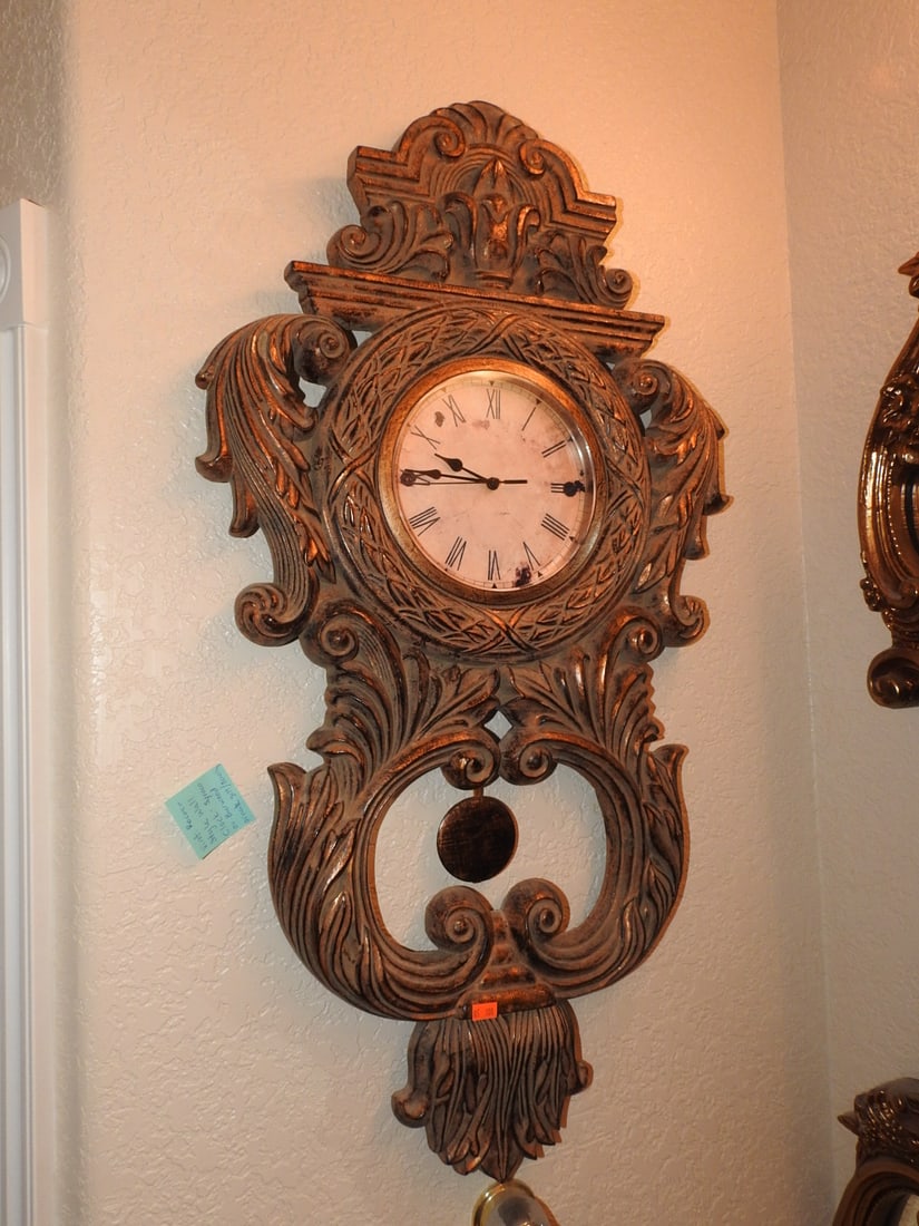 Vintage Rococo Style Gilt Wall Clock: Vintage Rococo style gilt wall clock with ornate molded scrollwork, round clock face, and mirrored accent section. Back label notes hanging clock, model 32711-56FB, made in China. Approx. 33 x 18.5 x 