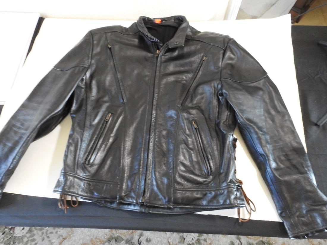 Black FMC Leather Jacket: Black FMC leather jacket, size medium. No liner present; measured as packed. Approx. 8 x 18 x 15 in.