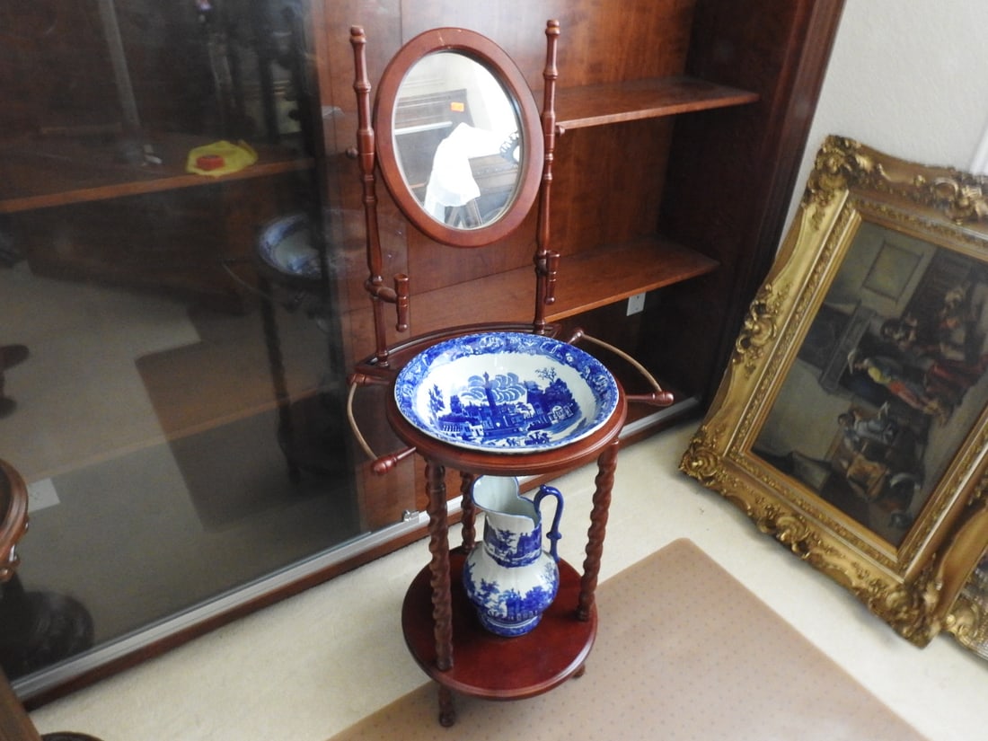 Victorian Style Cherry Wood Wash Stand with Blue Willow Bowl: Victorian style wash stand with cherry wood finish, mirror, storage shelves, and blue-and-white Blue Willow style ceramic basin. Chinese export / made in China mark visible. Approx. 53 x 23 x 20 in.