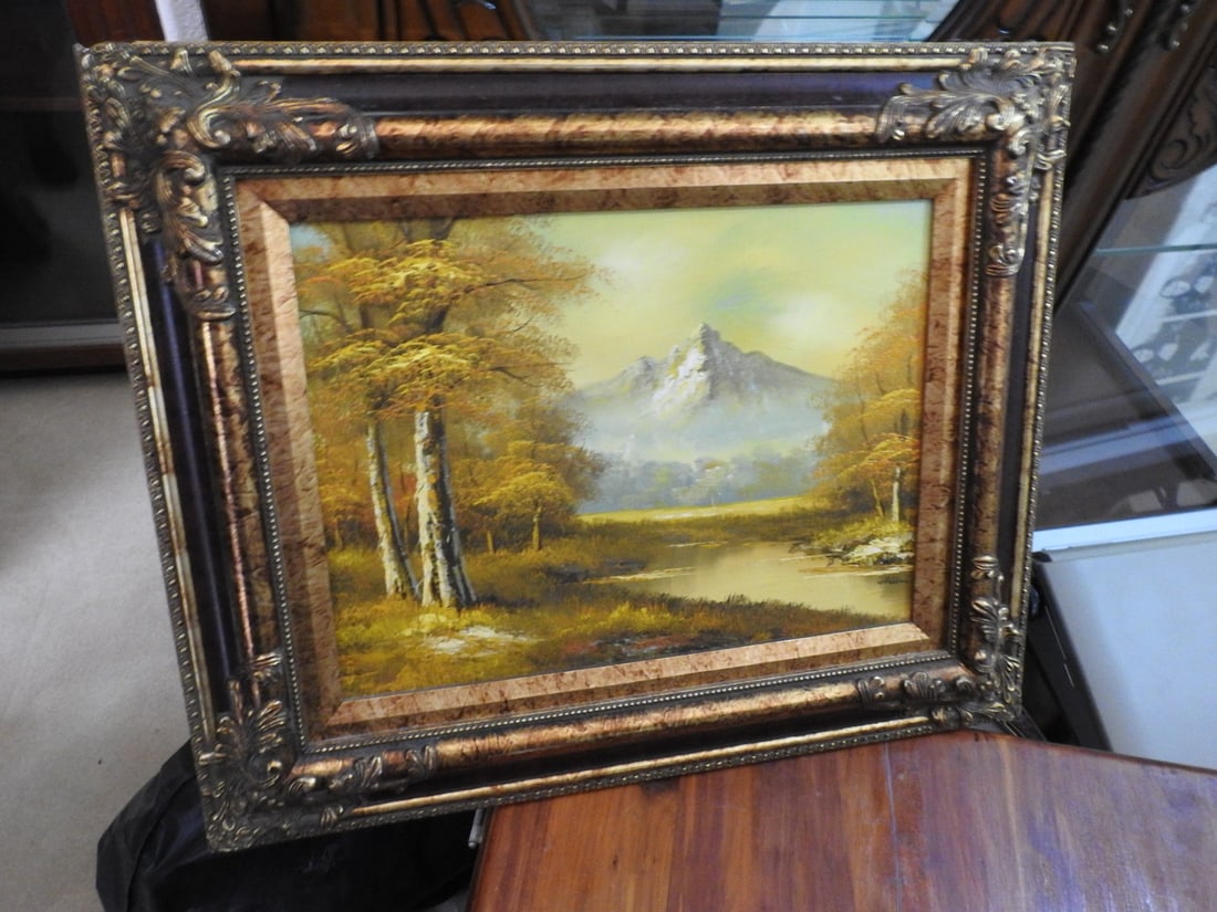 Artist-Signed Landscape Oil on Canvas: Artist-signed landscape oil on canvas in ornate frame, depicting a soft countryside scene. Approx. 19.5 x 23 x 2.5 in.