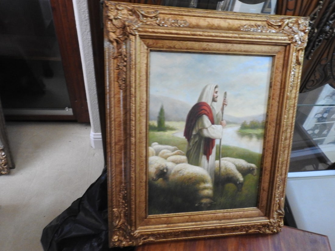 The Good Shepherd Framed Canvas Reprint: Framed canvas reprint of The Good Shepherd, depicting a shepherd with sheep in a pastoral setting. Approx. 24 x 20 x 2.5 in.